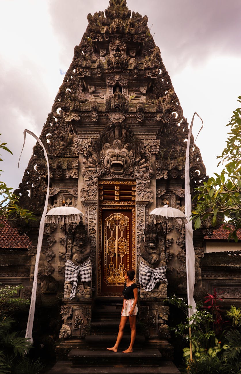 photo of woman standing near monument